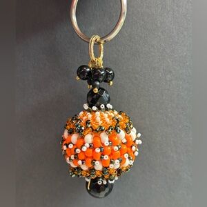 Beaded Keychain with Orange and Black Accents